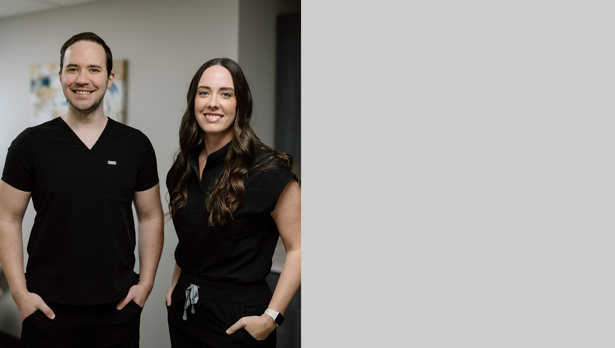 Brandon dentists smiling and standing with their arms crossed