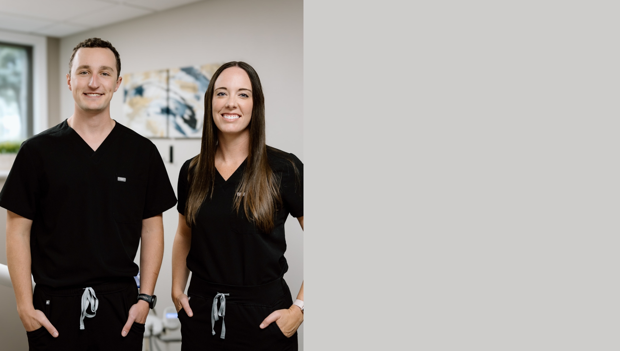 Brandon dentists smiling and standing with their arms crossed