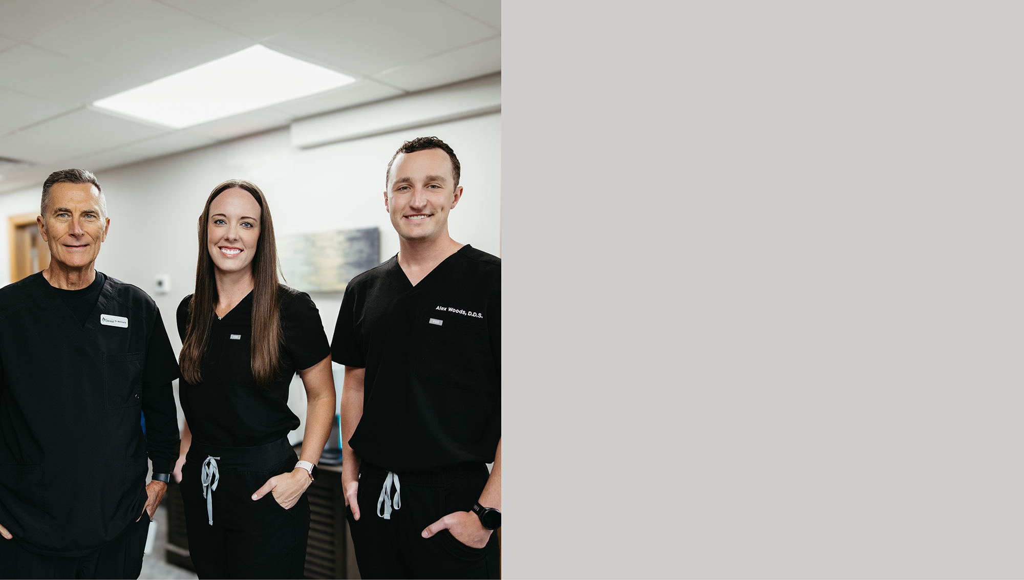 Brandon dentists smiling and standing with their arms crossed