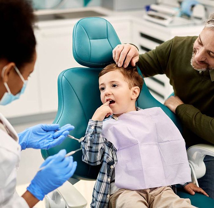 Man with dental mirror inside of his mouth