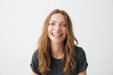 A woman smiling