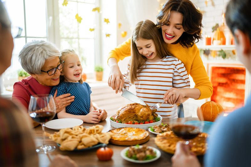 Patient smiling with family at Thanksgiving